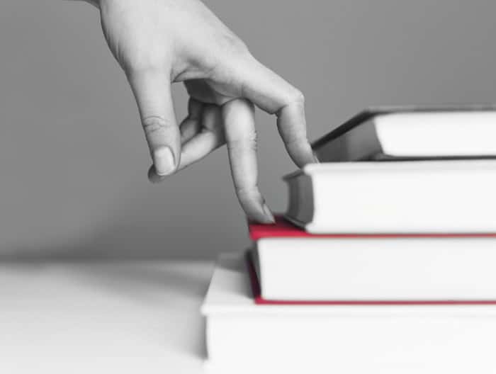 WP Creative, Design and Marketing Agency Suffolk, Copy Writing Services, A Hand Travelling up a Book Depicting Engaged Online Content