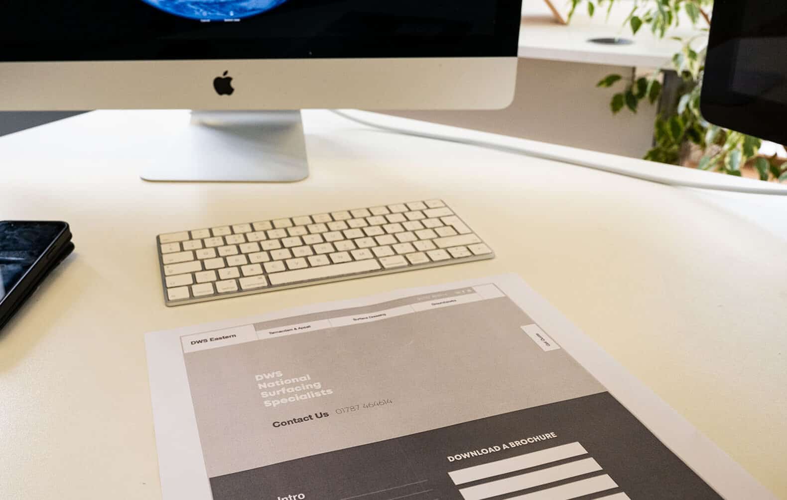 Website wireframe print out on a desk. How much a website costs blog, Suffolk marketing agency, WP creative